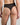 Model wears Sheer Essence Thong in BLACK. On body back view