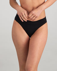 Model wears Play Bikini in BLACK. On body front view