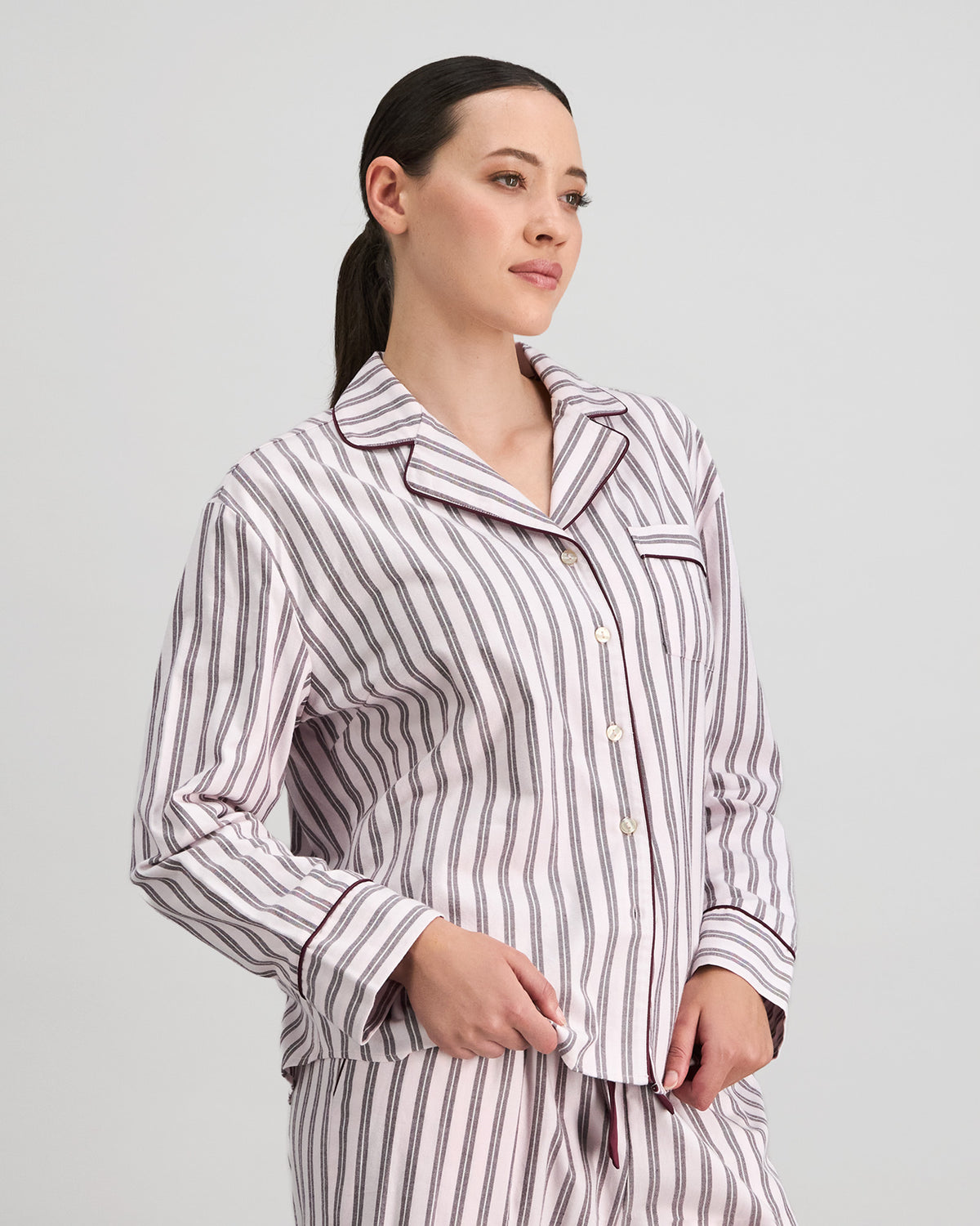 Model wears Cosy Flannel Long Sleeve Pj Top in PINK-A-BOO. On body side view