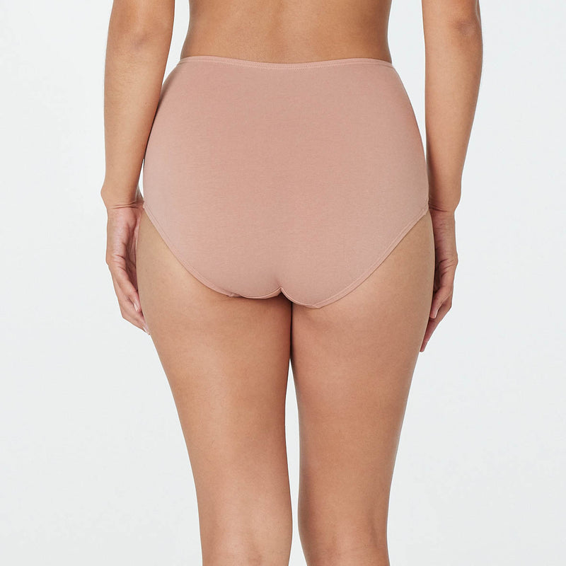 Model wears Freestyle Full Brief in COCOA. On body back view