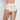 Model wears Lace Full Brief in WHITE. On body back view