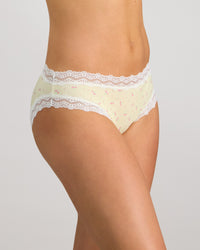 Model wears Daily Micro Bikini in TRANSPARENT YELLOW. On body side view