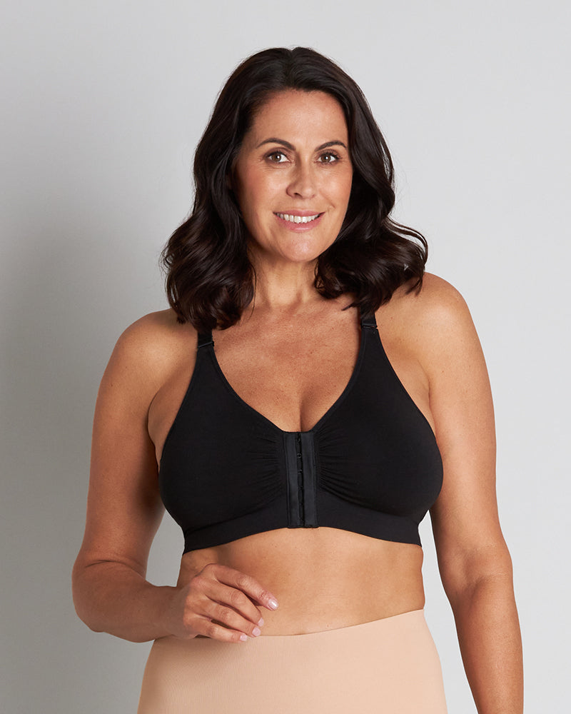 Model wears Bendon Restore Wire Free Front Opening Bra in BLACK. On body front view