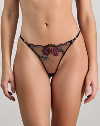 Model wears Niara Thong in BLACK/BEAUJOLAIS. On body front view