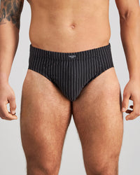 Model wears Cotton Stretch Mens Brief in BLACK PINSTRIPE. On body front view