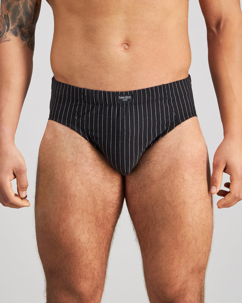 Model wears Cotton Stretch Mens Brief in BLACK PINSTRIPE. On body front view