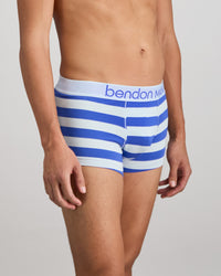 Model wears Rugby Stripe Mens Trunk in SKYWAY/DAZZLING BLUE. On body side view