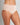 Model wears Au Naturel Full Brief in LATTE. On body side view