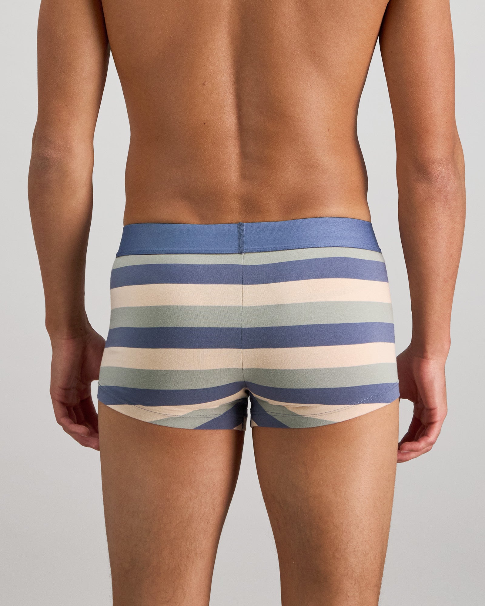Model wears Rugby Stripe Mens Trunk in INDIGO/ICEBERG/SMOKE. On body back view