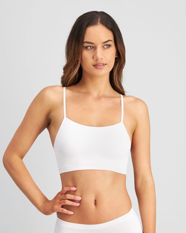 Model wears Simply Seamless Crop Top in WHITE. On body front view