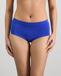 Model wears Seamless Soft Full Brief in DAZZLING BLUE. On body front view