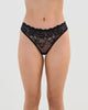 Model wears All Lacey Thong in BLACK. On body front view