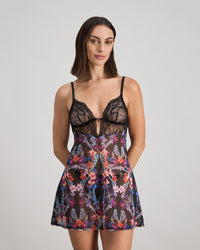 Model wears Adaline Chemise in BLACK FLORAL PRINT. On body front view