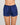 Model wears Silk Brilliance Short in INK. On body front view