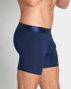 Model wears Bamboo Mens Trunk in Medieval Blue. On body side view