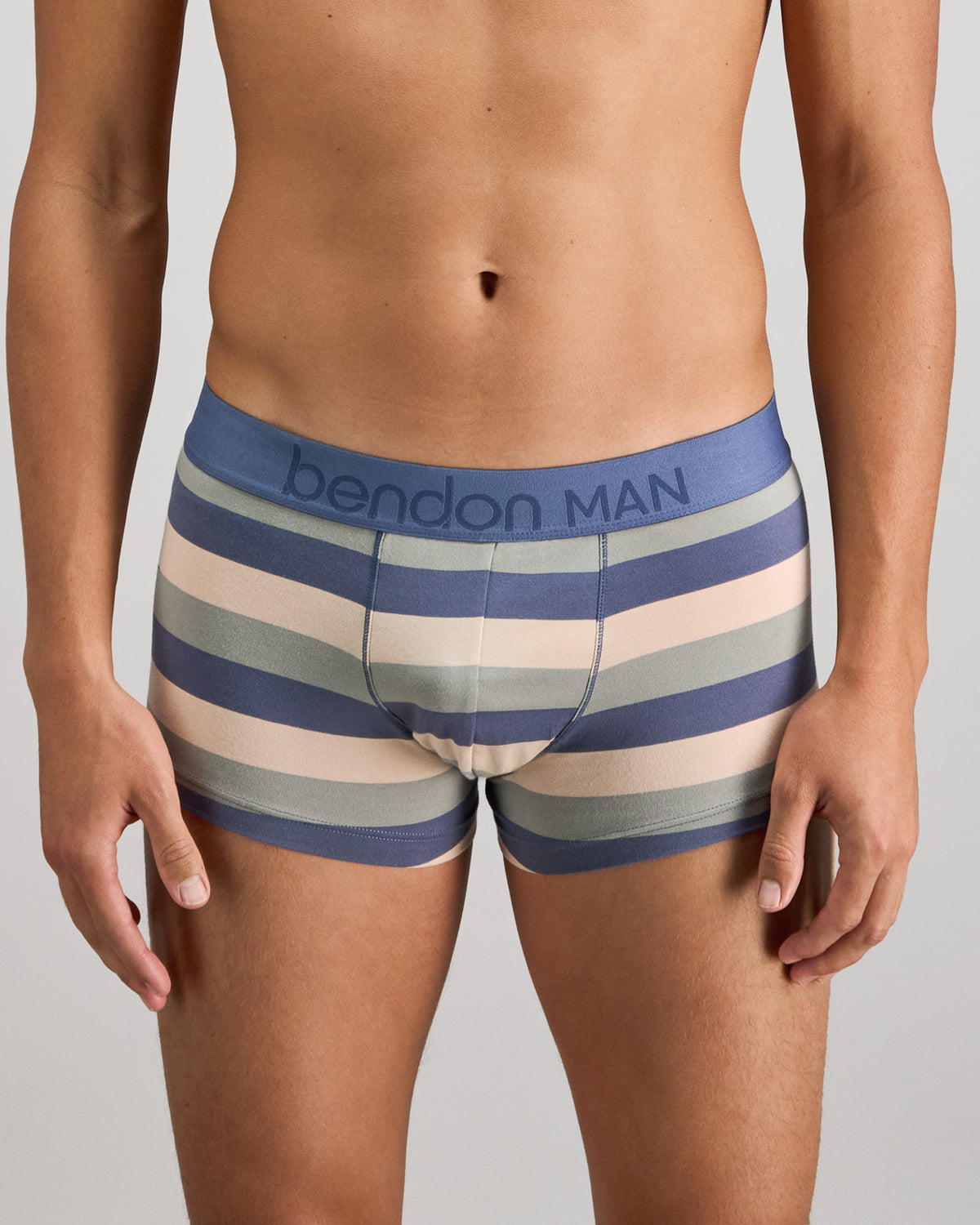 Model wears Rugby Stripe Mens Trunk in INDIGO/ICEBERG/SMOKE. On body front view