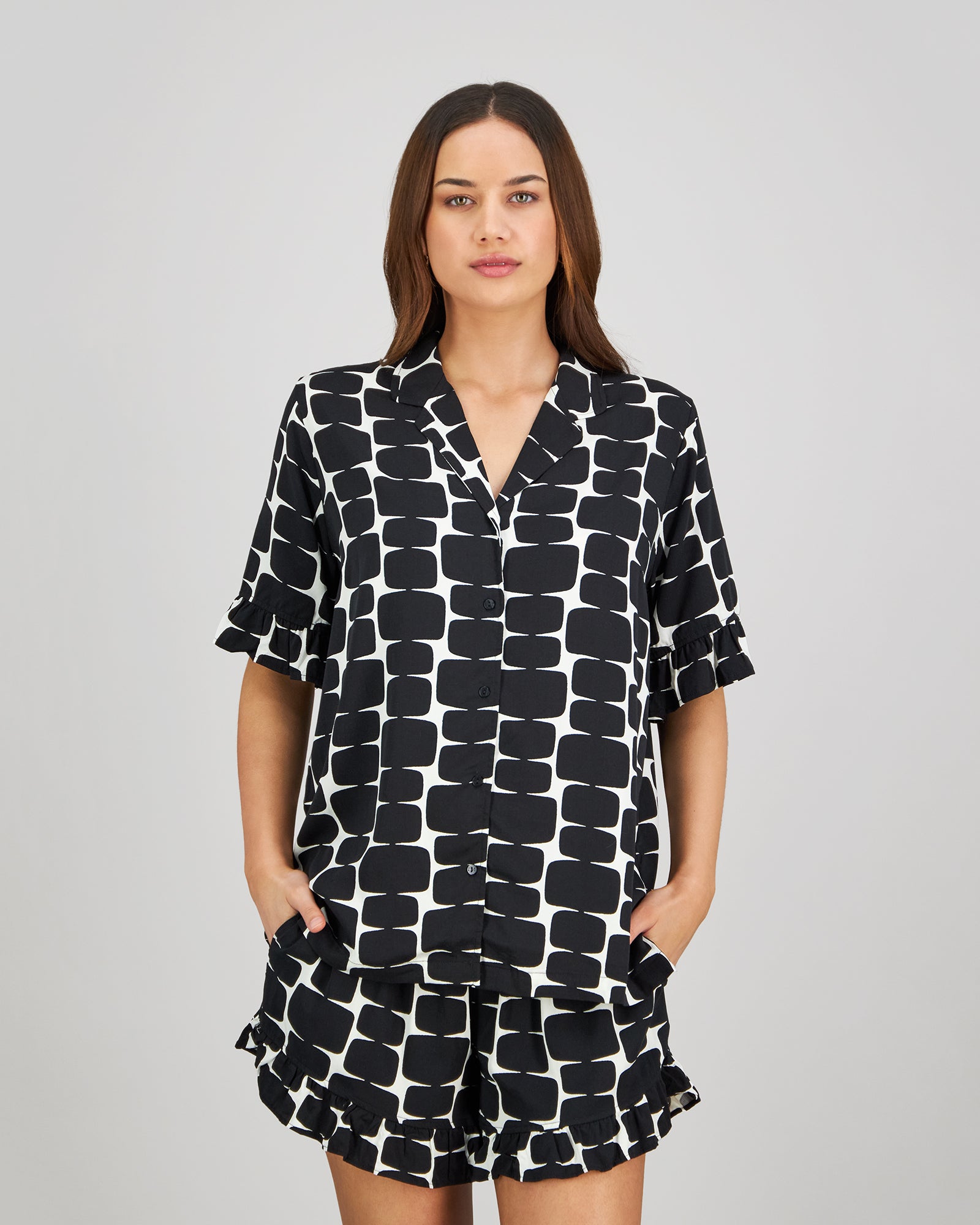 Model wears Audacious Dreams Short PJ in MINIMALIST PRINT. On body front view