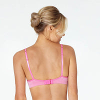 Model wears Simply Seamless Contour Bra in SHOCKING PINK MARLE. On body back view
