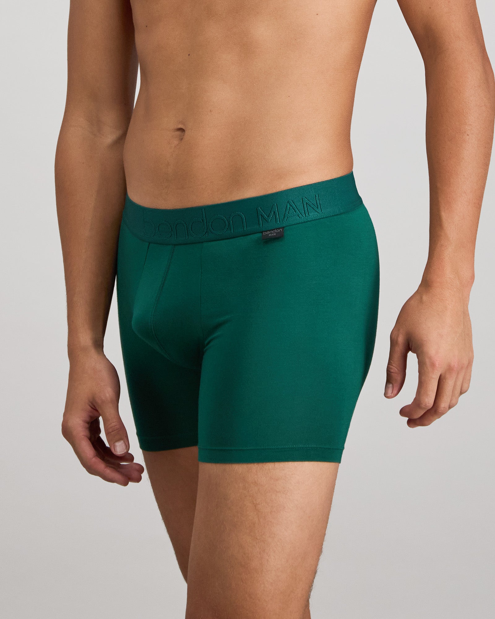 Model wears Bamboo Mens Trunk in RAIN FOREST. On body side view