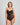 Model wears My Fit Lace Bodysuit in BLACK. On body front view