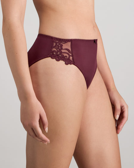 Model wears Coral High Cut Brief in FIG. On body side view