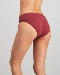 Model wears Body Cotton Bikini in OXBLOOD RED. On body back view