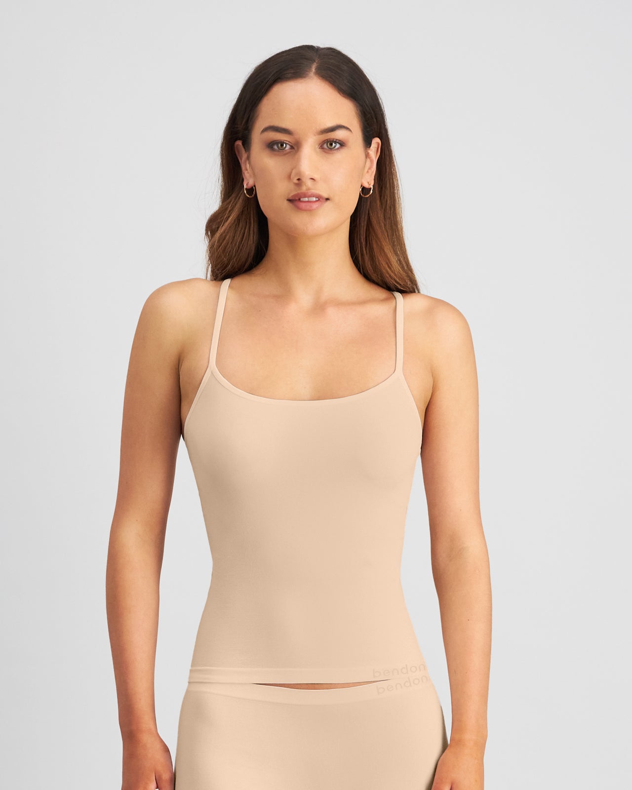 Model wears Simply Seamless Camisole in Nude. On body front view