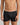 Model wears Cotton Stretch Mens Trunk in BLACK. On body front view