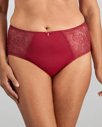 Model wears Daring Full Brief in TIBETAN RED. On body front view