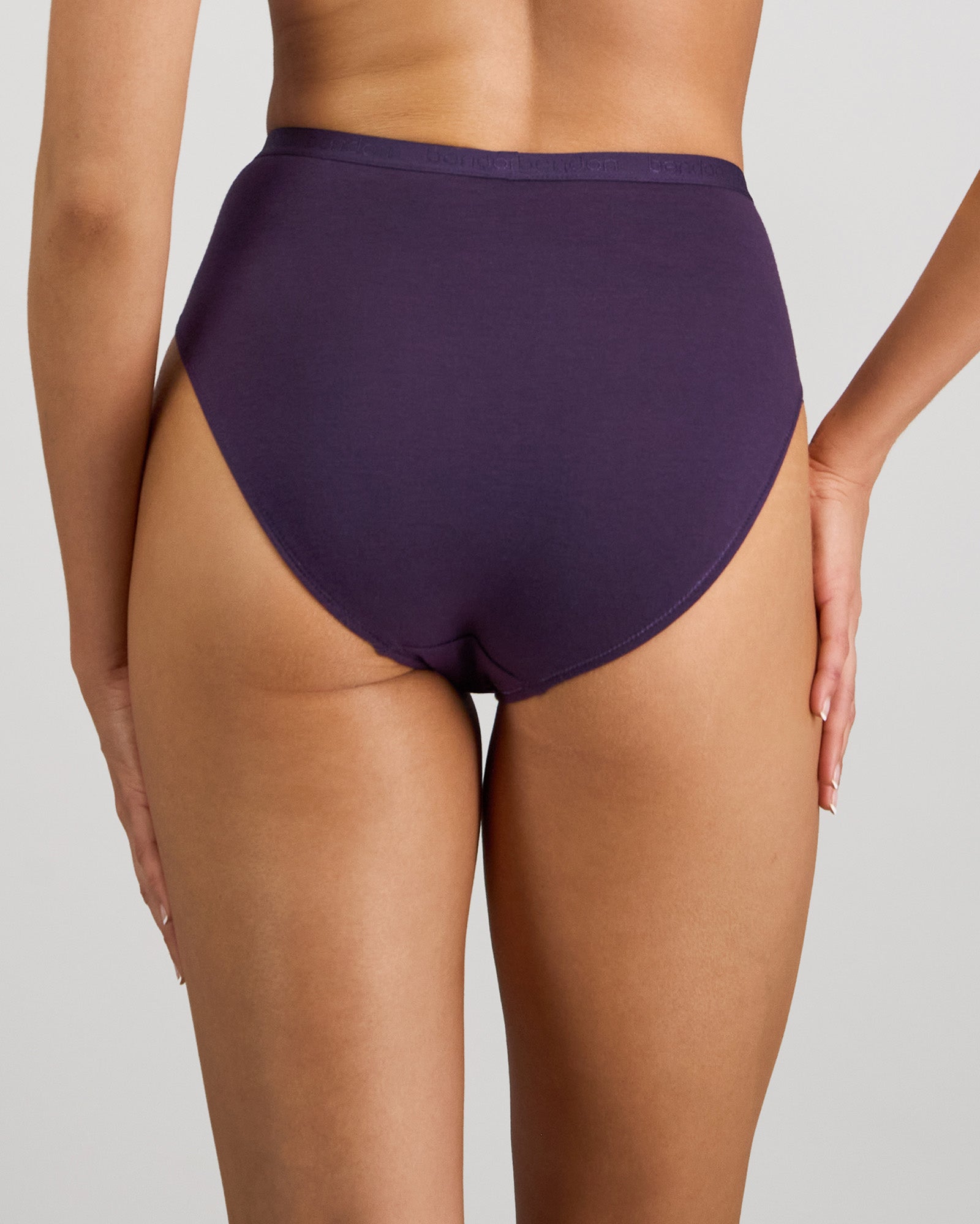 Model wears Body Cotton High Cut Brief in PURPLE VELVET. On body back view
