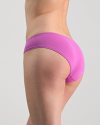 Model wears Seamless Soft Bikini in RADIANT ORCHID. On body back view