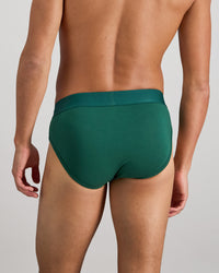 Model wears Bamboo Mens Brief in RAIN FOREST. On body back view