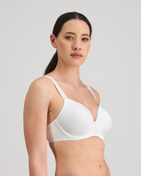 Model wears Rita Contour Bra in WHITE. On body side view