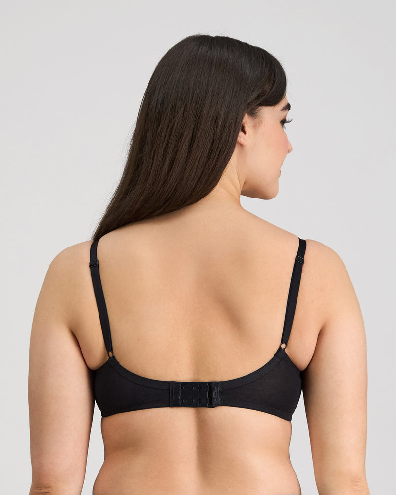 Model wears Embrace Contour Bra in BLACK. On body back view