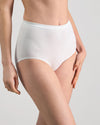 Model wears Freedom Full Brief in WHITE. On body side view
