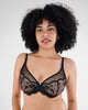 Model wears Romilly Underwire Bra in BLACK. On body front view
