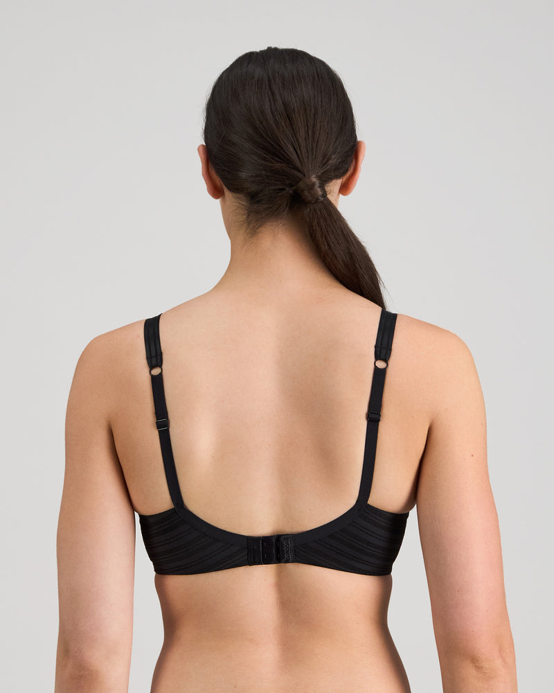 Model wears Rita Contour Bra in BLACK. On body back view