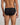 Model wears Bamboo Mens Brief in BLACK. On body back view