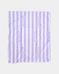 Model wears BB Stripe Wash Bag in STRIPE. On body back view