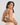 Model wears Bendon Nurture Maternity Bra in LATTE. On body back view