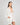 Model wears Eros Robe in SUGAR. On body side view
