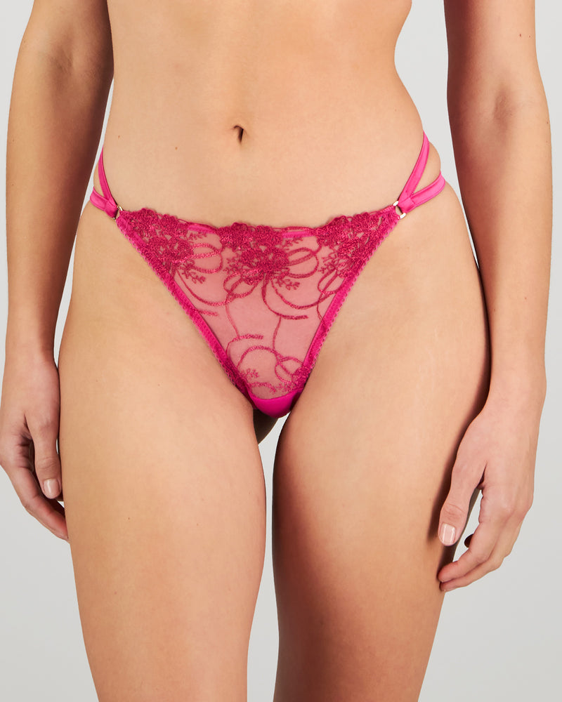 Model wears Heritage Bloom Thong in FANTASY FUCHSIA. On body front view
