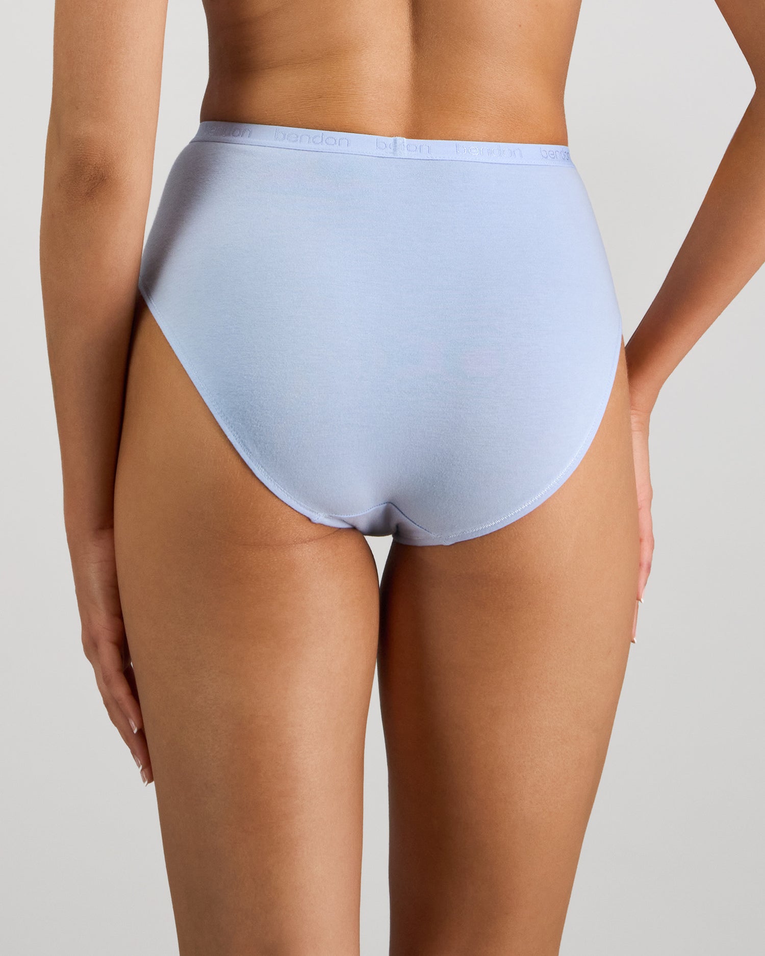 Model wears Body Cotton High Cut Brief in SKYWAY. On body back view