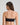 Model wears Extra-Ordinary Bandeau in BLACK. On body back view