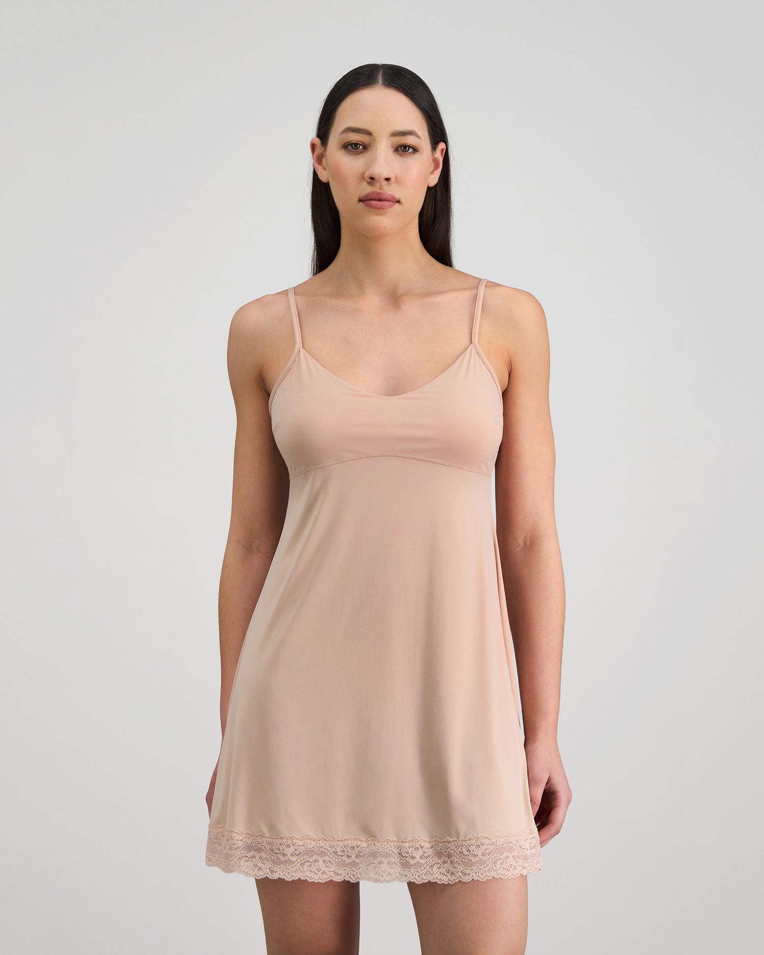 Model wears Understatement Slip in LATTE. On body front view