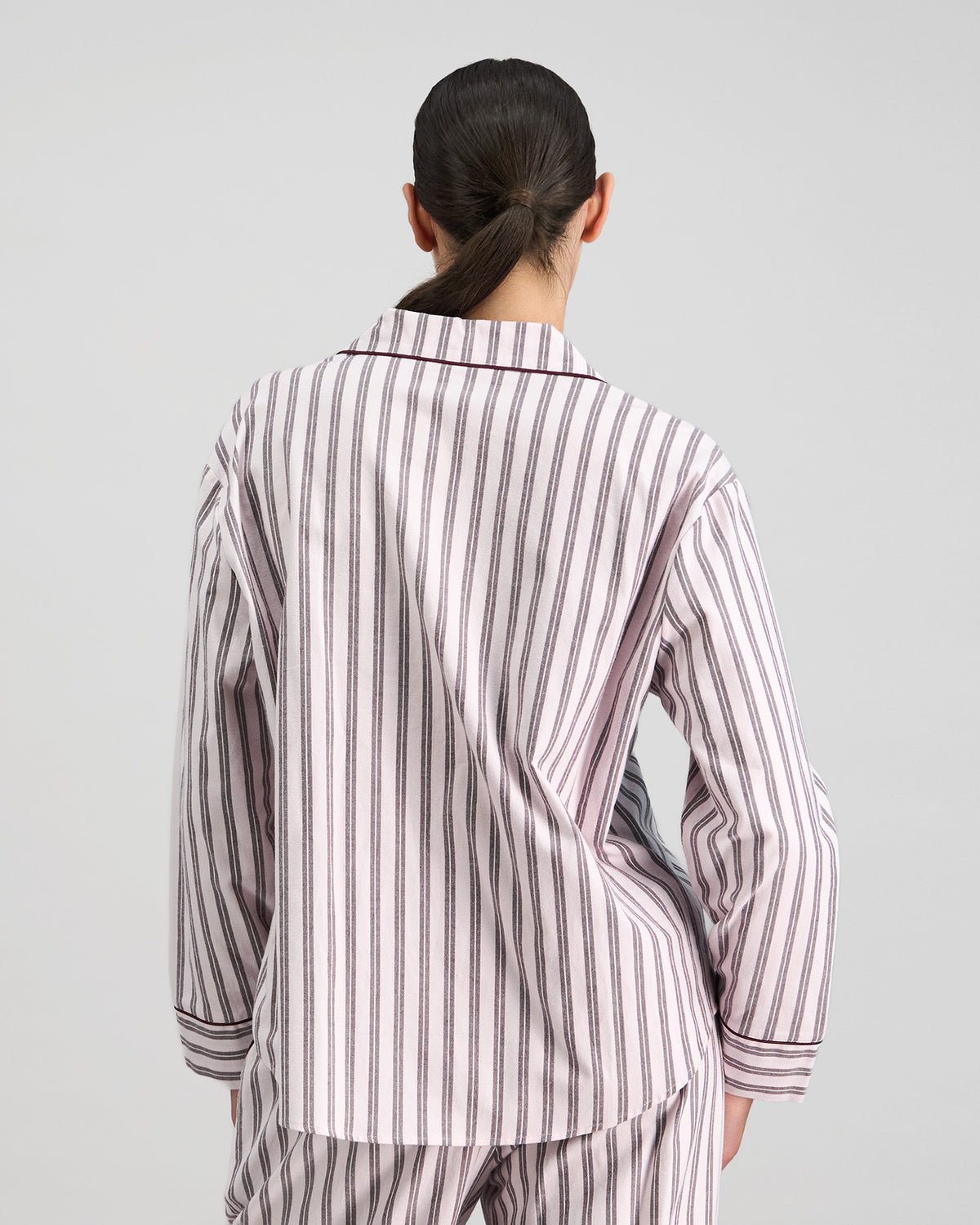 Model wears Cosy Flannel Long Sleeve Pj Top in PINK-A-BOO. On body back view