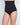 Model wears Bamboo Bodywear High Waisted Brief in BLACK. On body side view