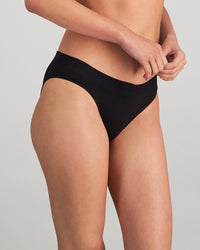 Model wears Play Bikini in BLACK. On body side view