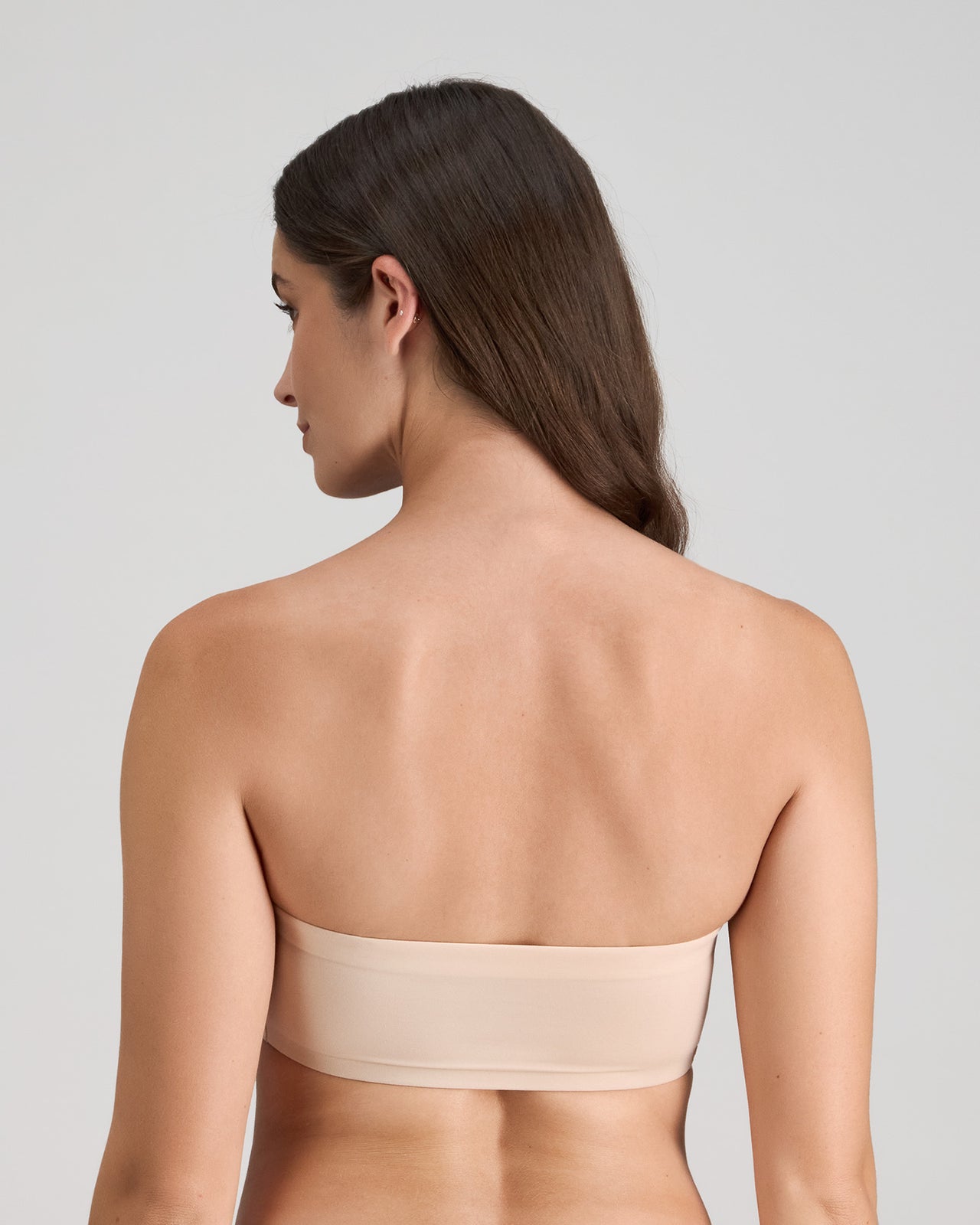 Model wears Extra-Ordinary Bandeau in LATTE. On body back view