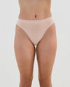 Model wears Seamless Soft High Cut Brief in LATTE. On body front view